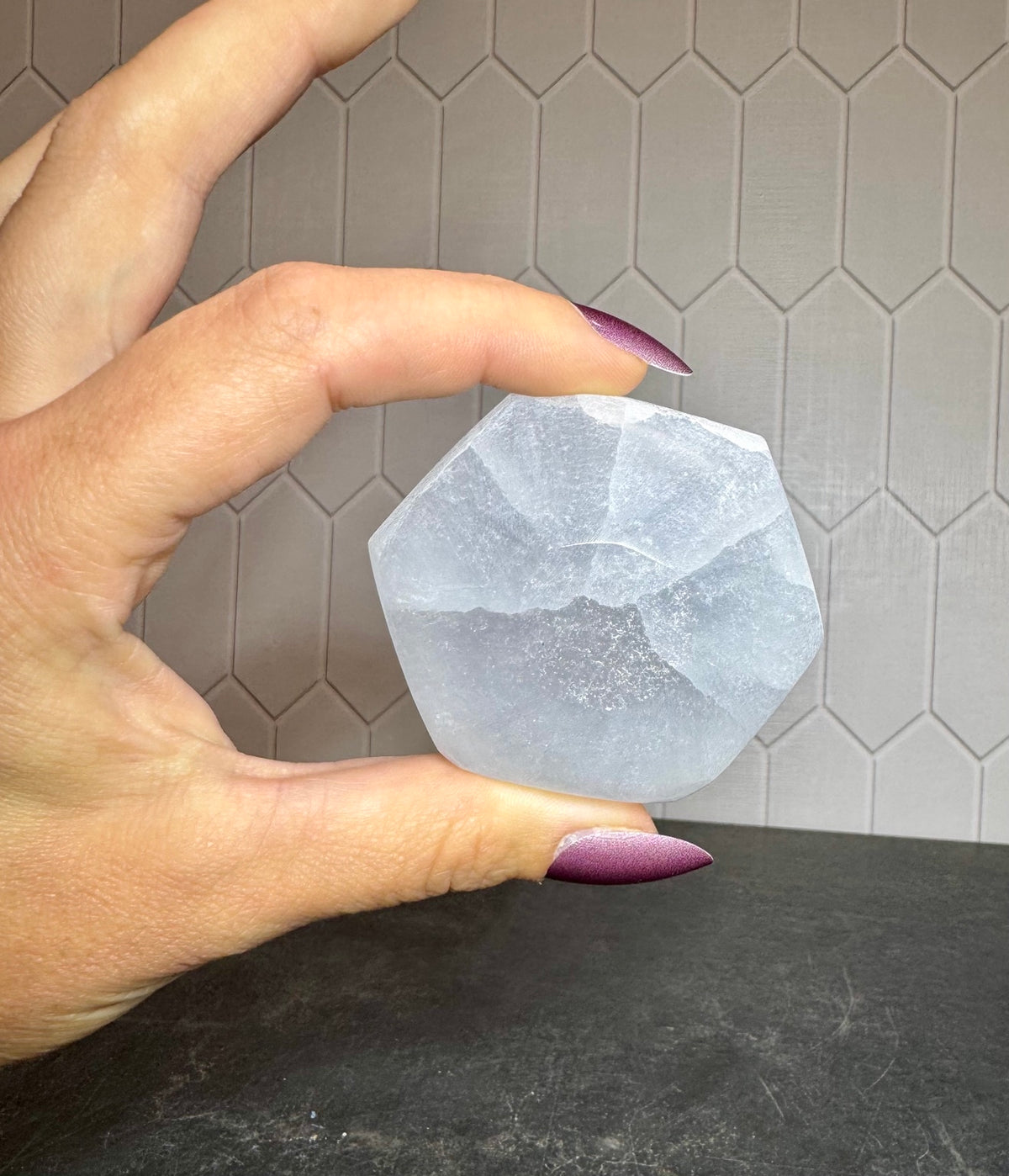 Bottom view of a white selenite hexagon bowl