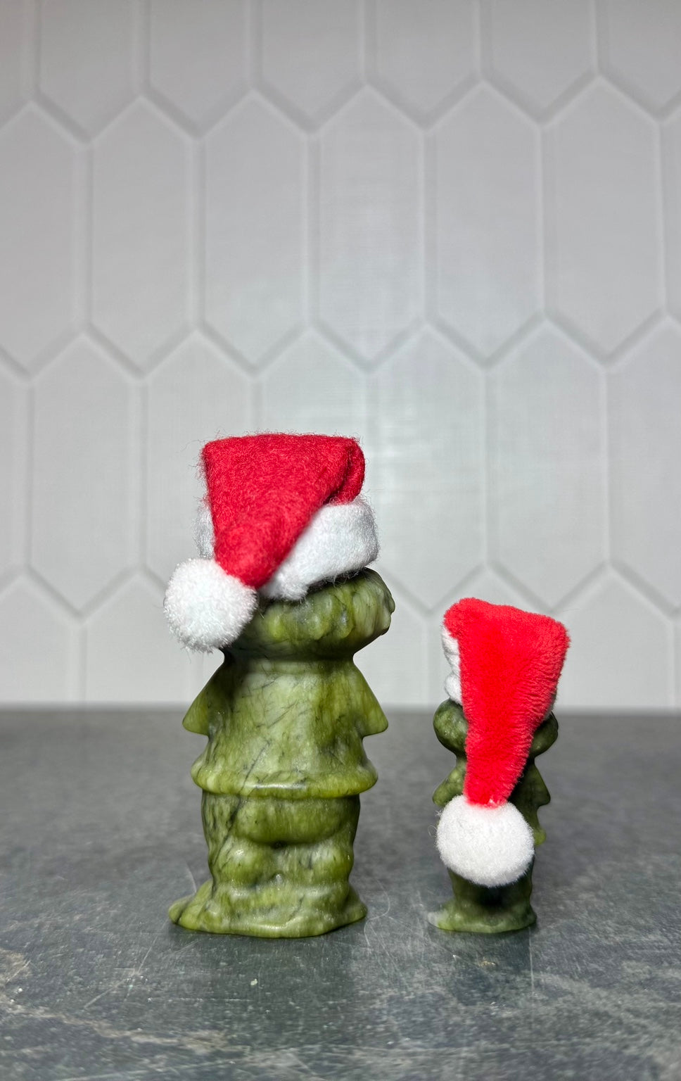 Green jade Grinch carvings in both available sizes, back view